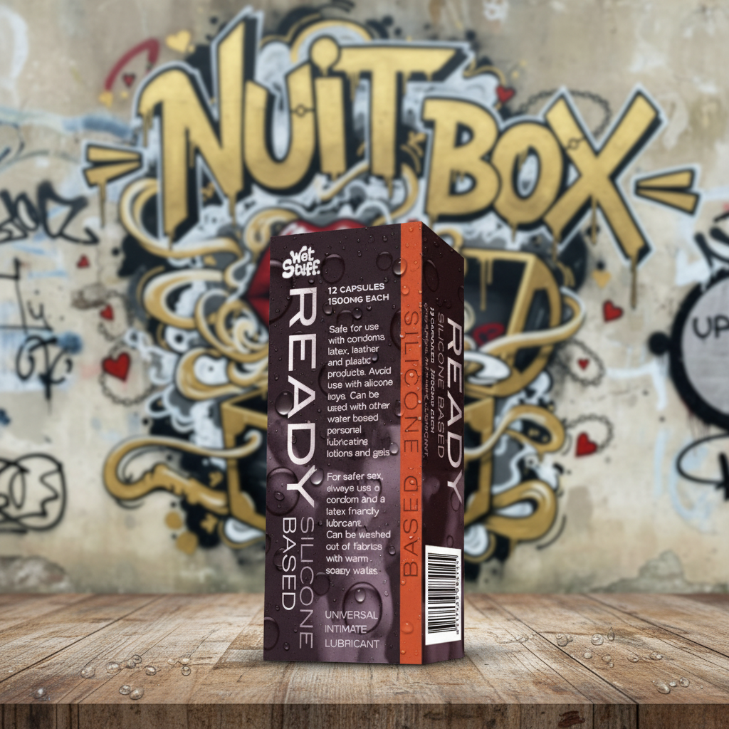 Caja de lubricante íntimo Wet Stuff Ready silicona sobre mesa, fondo mural Nuit Box, sex shop online Quilpué